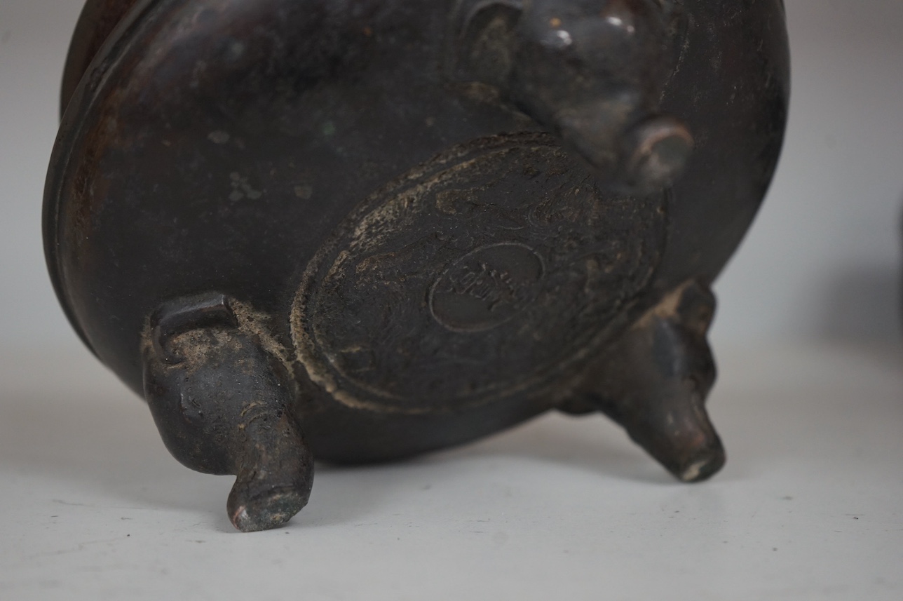 A Chinese bronze censer, character mark to base, 14cm. Condition - fair to good